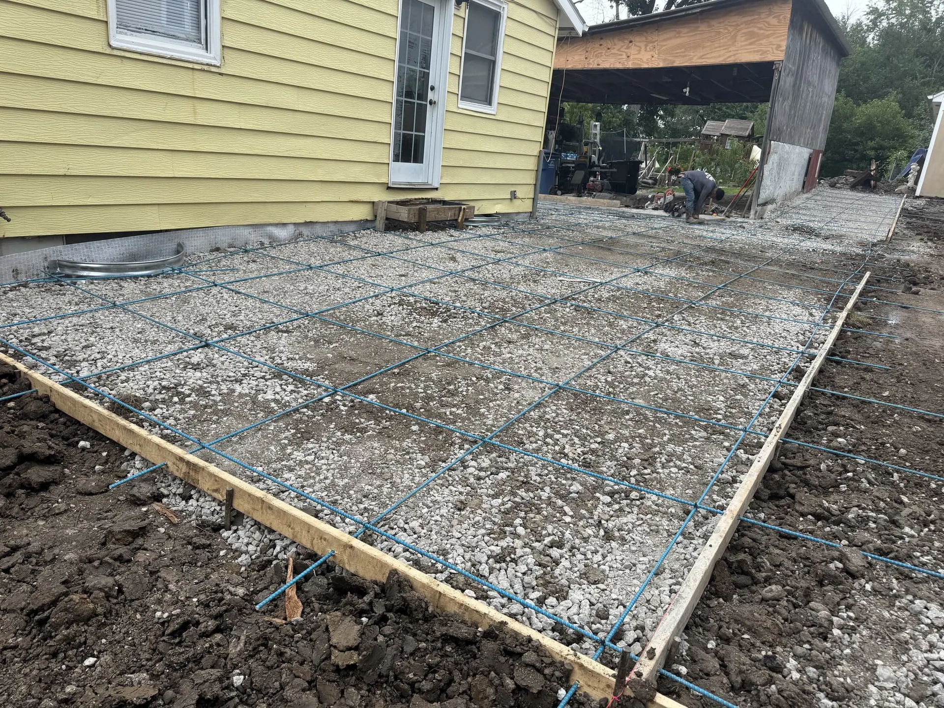 Rebar grid tied over a compacted gravel base, ready for the pour.